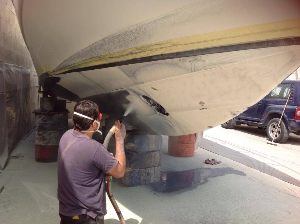 Boat hull during dustless blasting